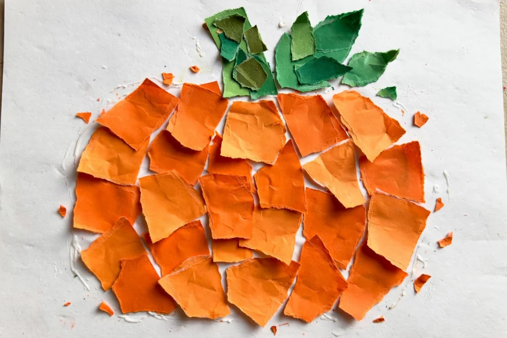 Torn paper pumpkin collage — Halloween craft for children